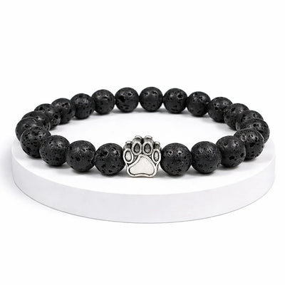 Bracelet Nuit Pattes de Secours — perles pierre de lave noire, breloque patte